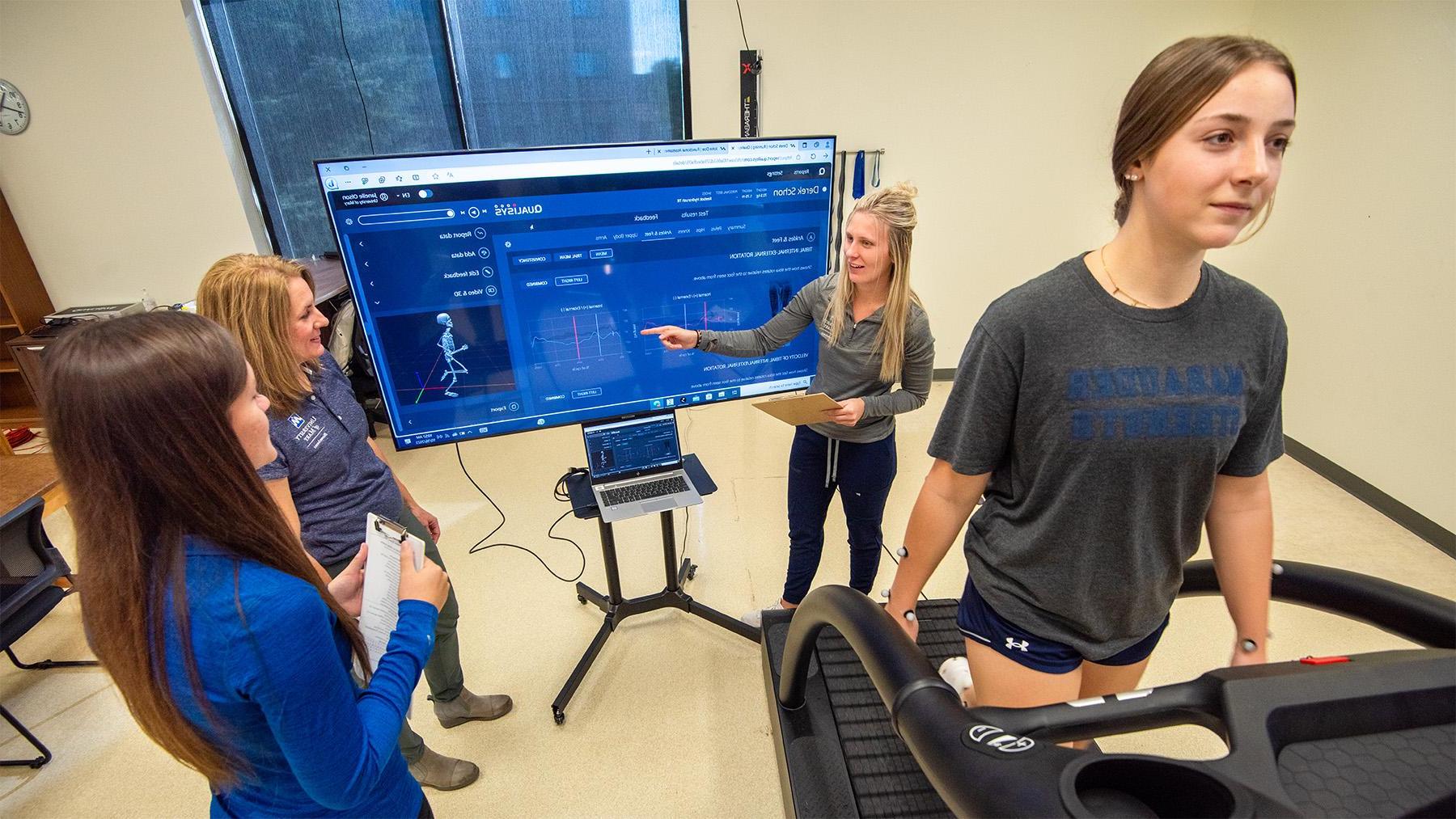 Students working in the health sciences lab tracking movement in the body.